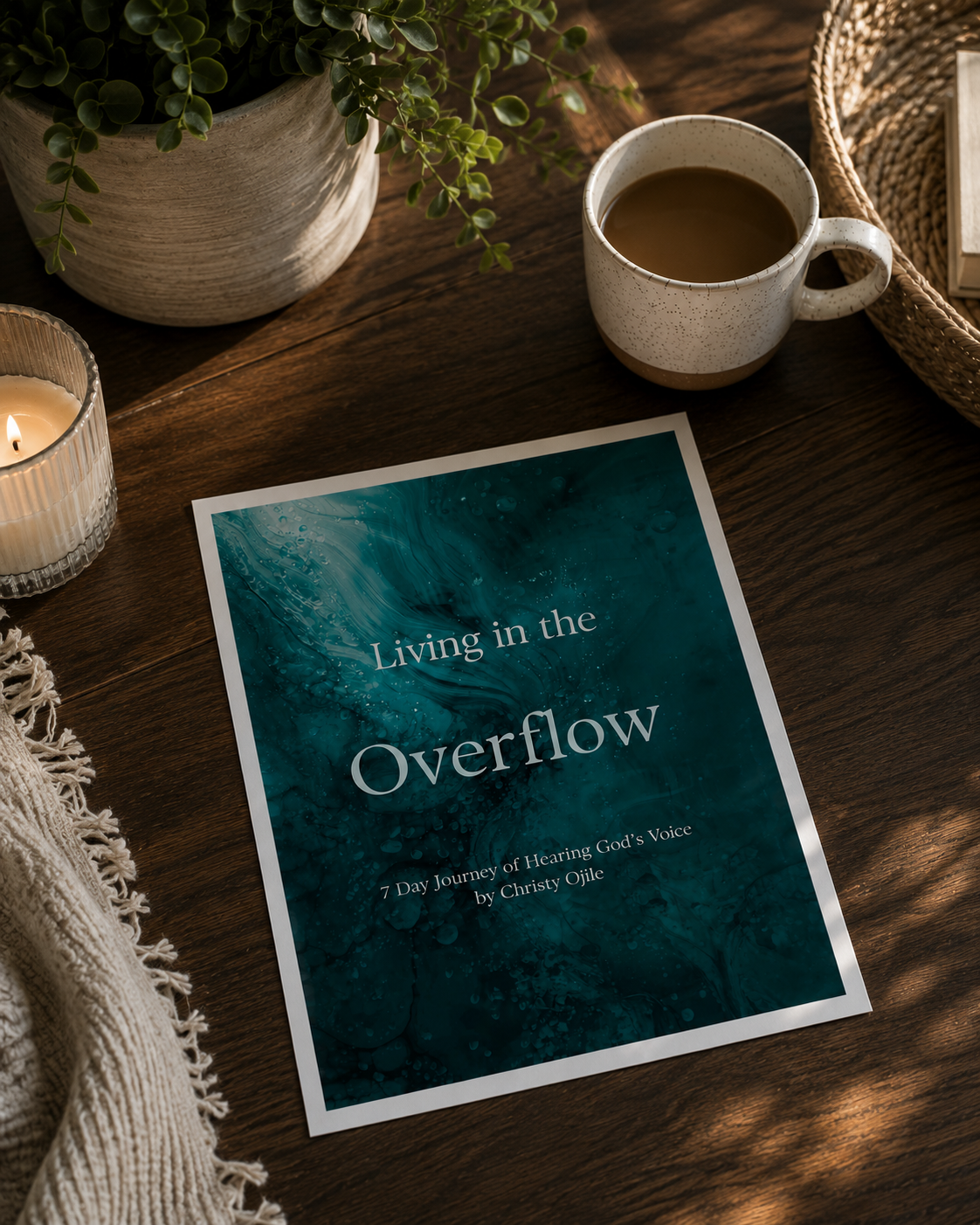 Free devotional for Christian moms who are overwhelmed by life laying on a coffee table with candle beside it.